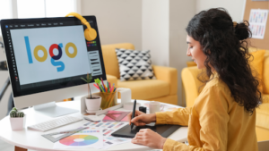 girl with yellow shirt designing logo for drupal website